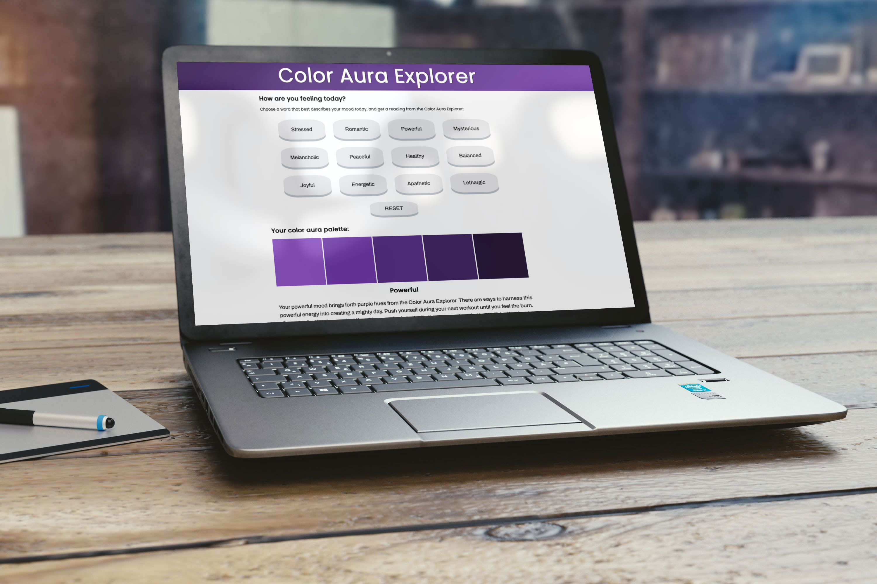 A small mockup of project two, called Color Aura Explorer, on a laptop screen.